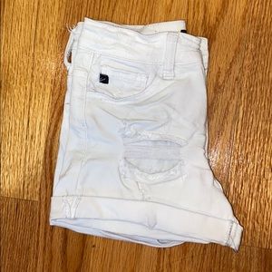 white ripped shorts